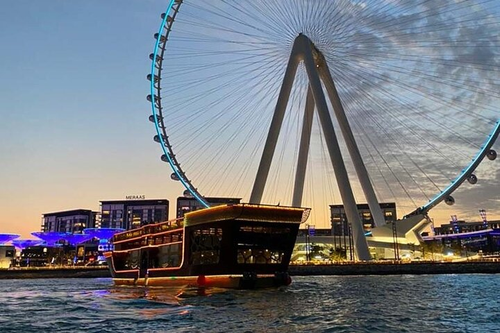 Experience a luxurious dinner cruise on the Ocean Empress where stunning views of Dubai's skyline and a sumptuous buffet create unforgettable memories against the backdrop of the iconic Ferris wheel.